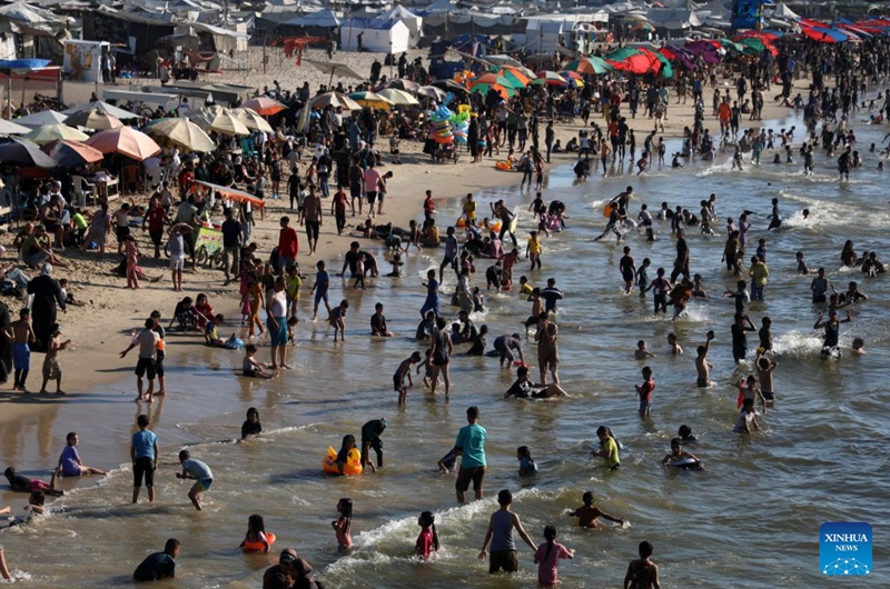 People relax on the beach in Gaza City, on July 17, 2026. (Photo by Rizek Abdeljawad/Xinhua)