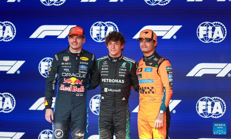 Pole Position sitter Mercedes' Italian driver Kimi Antonelli (C), 2nd place Red Bull's Dutch driver Max Verstappen (L) and 3rd place McLaren's British driver Lando Norris pose for a group photo after the Qualifying of the Formula One Belgian Grand Prix at the Spa-Francorchamps circuit in Stavelot, Belgium, on July 18, 2026. (Photo by Bao Di/Xinhua)