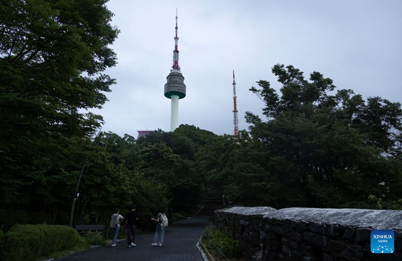 Tourists enjoy the scenery around the Namsan Seoul Tower in Seoul, South Korea, July, 18, 2026. (Photo by Jun Hyosang/Xinhua)
