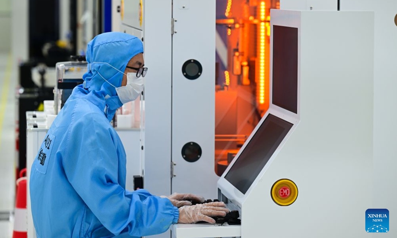 A staff member works on a brain-computer interface (BCI) electrode production line at a company in China Sensor Valley in Bengbu, east China's Anhui Province, July 17, 2026. Bengbu, a traditional industrial city, has stepped up the development of its brain-computer interface (BCI) industry in recent years. By strengthening collaboration among industry, research institutes and medical institutions, Bengbu has built an innovation ecosystem that supports both BCI research and clinical application, aiming to become an emerging BCI innovation hub in the Yangtze River Delta region. Photo: Xinhua