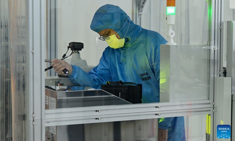 A staff member works on a brain-computer interface (BCI) electrode production line at a company in China Sensor Valley in Bengbu, east China's Anhui Province, July 17, 2026. Bengbu, a traditional industrial city, has stepped up the development of its brain-computer interface (BCI) industry in recent years. By strengthening collaboration among industry, research institutes and medical institutions, Bengbu has built an innovation ecosystem that supports both BCI research and clinical application, aiming to become an emerging BCI innovation hub in the Yangtze River Delta region. Photo: Xinhua
