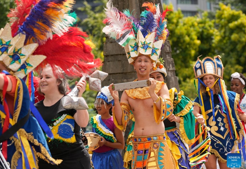 Participants in traditional costumes march during the Parade of Cultures at the Fusion Festival in Surrey, British Columbia, Canada, July 18, 2026. The two-day festival, which opened here on Saturday, featured over 50 cultural pavilions offering food, music, dance, and cultural performances from around the world. (Photo by Liang Sen/Xinhua)