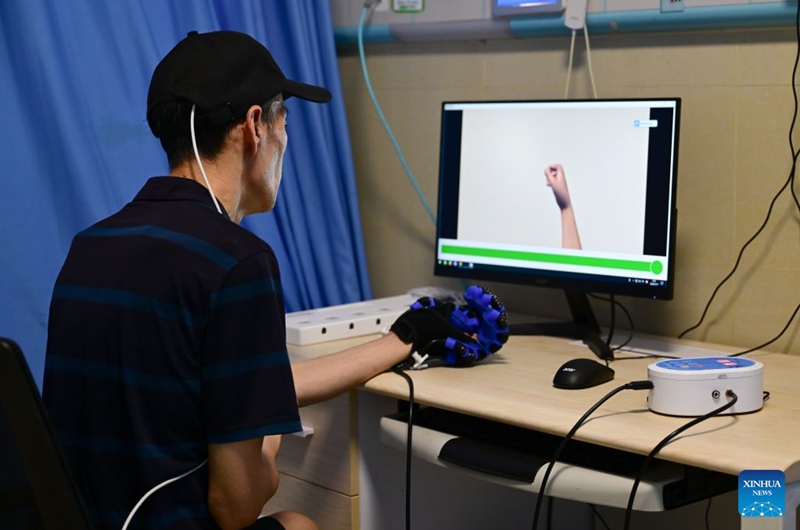 A patient, who received Anhui's first semi-invasive brain-computer interface (BCI) surgery in April 2026, undergoes rehabilitation training at a hospital in Bengbu, east China's Anhui Province, July 17, 2026. Bengbu, a traditional industrial city, has stepped up the development of its brain-computer interface (BCI) industry in recent years. By strengthening collaboration among industry, research institutes and medical institutions, Bengbu has built an innovation ecosystem that supports both BCI research and clinical application, aiming to become an emerging BCI innovation hub in the Yangtze River Delta region. Photo: Xinhua