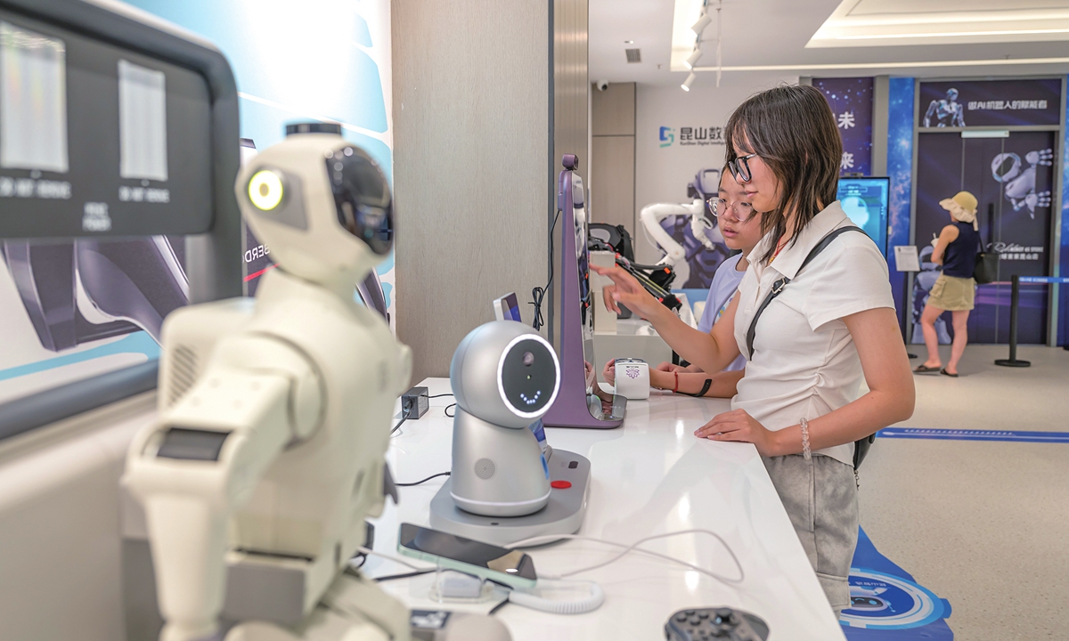 Visitors tour the robotics 6S Store which opens in Kunshan, East China's Jiangsu Province on July 19, 2026, offering integrated sales, spare parts, after-sales service, feedback, leasing, and customization services while serving as a hub for humanoid robots, drones, training, and industry incubation. Photo: VCG