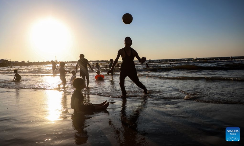 People relax on the beach in Gaza City, on July 17, 2026. (Photo by Rizek Abdeljawad/Xinhua)