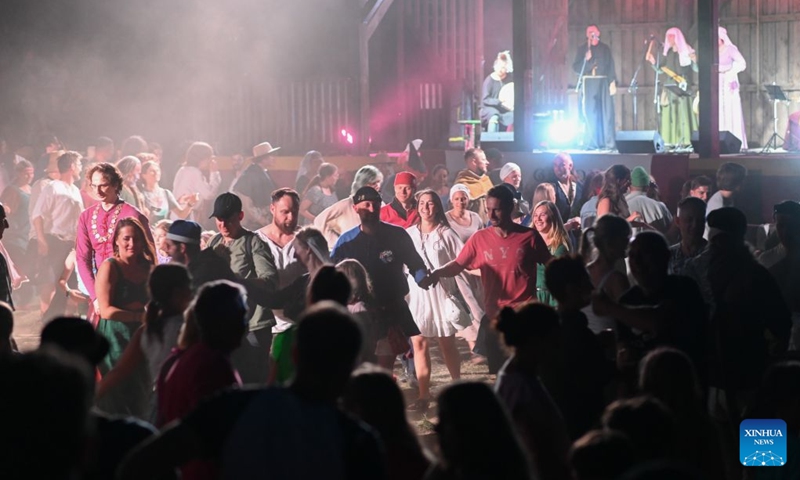 People dance during the Grunwald Days festival in Grunwald, Poland, July 17, 2026. The annual Grunwald Days festival commemorates the Battle of Grunwald in 1410, which is regarded as one of the most important battles in Polish history. The festival runs from Wednesday through Sunday this year. (Photo by Alexey Vitvitsky/Xinhua)