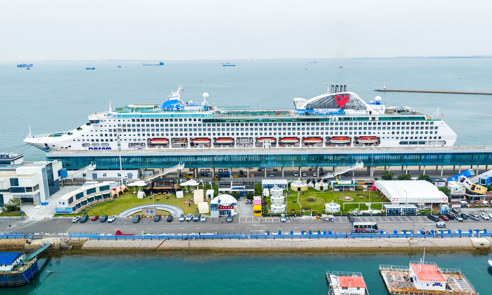 The cruise ship Dream docks at the Qingdao Cruise Home Port to serve as the static venue of a cruise beer festival in Qingdao, East China's Shandong Province on July 19, 2026. China's cruise ship industry could contribute 500 billion yuan ($73.82 billion) in output to the country's economy by 2035, according to media reports. Photo: VCG