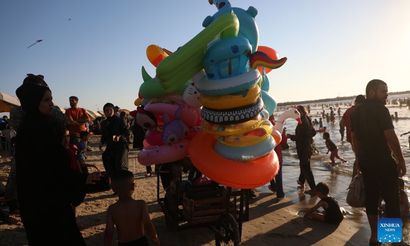 People relax on the beach in Gaza City, on July 17, 2026. (Photo by Rizek Abdeljawad/Xinhua)