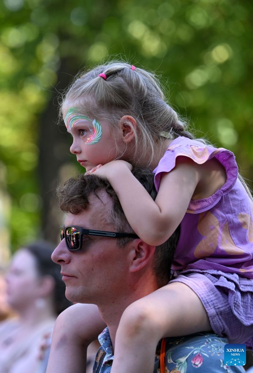 People watch a performance during a festival of Latin American and Caribbean culture at Hermitage Garden in Moscow, Russia, July 18, 2026. Featuring live music, performance and traditional cuisines, the festival kicked off here on Saturday and will run until July 26. (Xinhua/Feng Kaihua)
