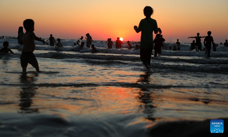 People relax on the beach in Gaza City, on July 17, 2026. (Photo by Rizek Abdeljawad/Xinhua)