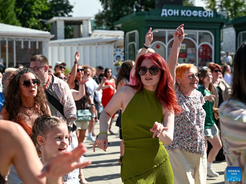 People dance during a festival of Latin American and Caribbean culture at Hermitage Garden in Moscow, Russia, July 18, 2026. Featuring live music, performance and traditional cuisines, the festival kicked off here on Saturday and will run until July 26. (Xinhua/Feng Kaihua)