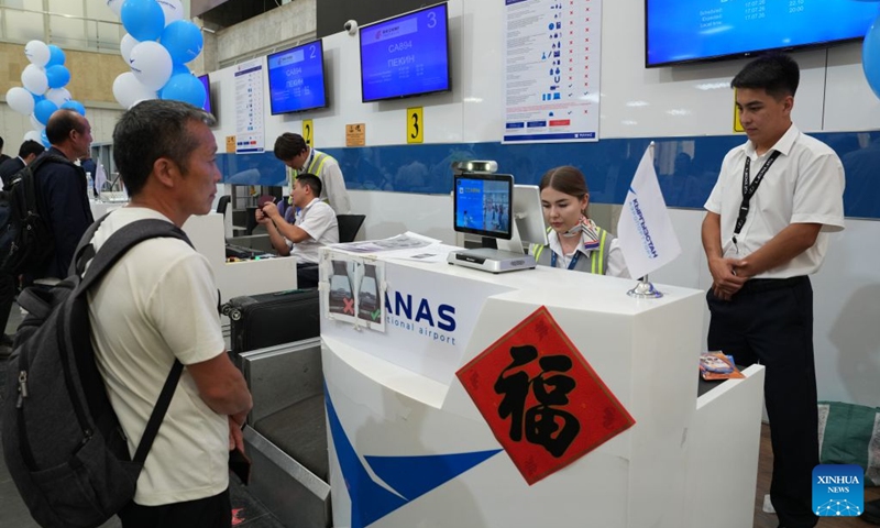 Passengers of flight CA894 check in at the Manas International Airport in Bishkek, Kyrgyzstan, July 17, 2026. Air China's inaugural direct flight between the capitals of China and Kyrgyzstan officially launched on Friday after flight CA893, departing from Beijing Capital International Airport, successfully landed at Manas International Airport in Bishkek.
According to Air China, regular flights in both directions of the new air service operate three times a week, namely on Mondays, Fridays, and Sundays. Flight CA893 departs from Beijing and travels to Bishkek, with a flight time of five hours 40 minutes; flight CA894 departs from Bishkek and travels to Beijing, with a flight time of four hours 50 minutes. Photo: Xinhua
