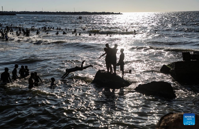 People relax on the beach in Gaza City, on July 17, 2026. (Photo by Rizek Abdeljawad/Xinhua)