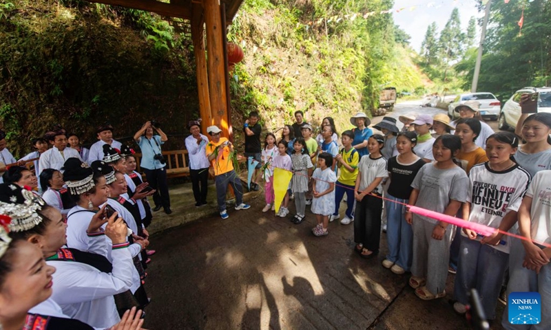 Children from Shenzhen sing Dong ethnic songs with locals in Meide Village of Congjiang County, Qiandongnan Miao and Dong Autonomous Prefecture, southwest China's Guizhou Province, July 17, 2026. In the summer vacation, a surging number of students from big cities like Shanghai and Shenzhen come to Meide Village of Qiandongnan Miao and Dong Autonomous Prefecture for a study tour, living with local people and experiencing the culture and customs of the Dong ethnic group. Photo: Xinhua
