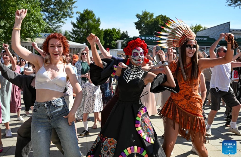 People dance during a festival of Latin American and Caribbean culture at Hermitage Garden in Moscow, Russia, July 18, 2026. Featuring live music, performance and traditional cuisines, the festival kicked off here on Saturday and will run until July 26. (Xinhua/Feng Kaihua)