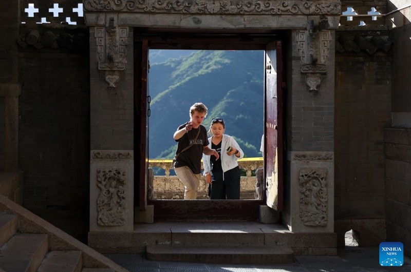 Tourists visit Mount Wutai, one of China's four sacred Buddhist mountains, in Xinzhou City of north China's Shanxi Province, July 15, 2026. Shanxi boasts magnificent natural scenery and landscapes, with three World Cultural Heritage sites including Pingyao, Yungang Grottoes and Mount Wutai, attracting tourists around the world. It is also home to more than 80 percent of the country's surviving timber structures built before the Yuan Dynasty (1271-1368), earning it the reputation of a museum of ancient Chinese architectural art.
Scenic areas across Shanxi have entered their peak season for tourism during summer vacation. Photo: Xinhua
