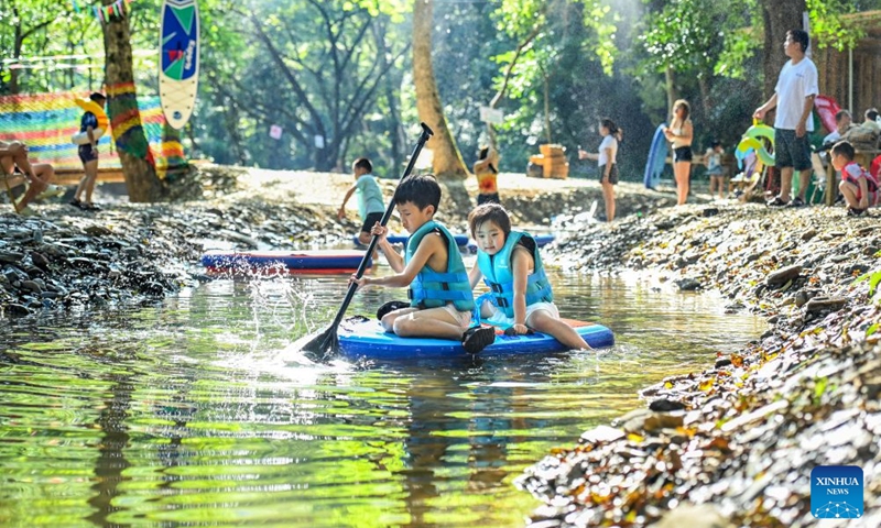 Children play at a camping site in Gaoqiao Township of Yichun City, east China's Jiangxi Province, July 17, 2026. (Photo by Zhou Liang/Xinhua)