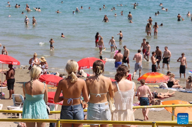 People enjoy leisure time at Bacvice Beach in Split, Croatia, on July 19, 2026. (Ivana Ivanovic/PIXSELL via Xinhua)