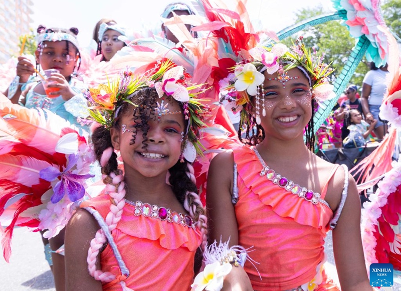 Dressed-up girls are seen during the Junior Carnival Parade of the 2026 Toronto Caribbean Carnival in Toronto, Canada, on July 19, 2026. Thousands of young participants in vivid costumes took part in the parade, celebrating Caribbean culture through music and dance. (Photo by Zou Zheng/Xinhua)