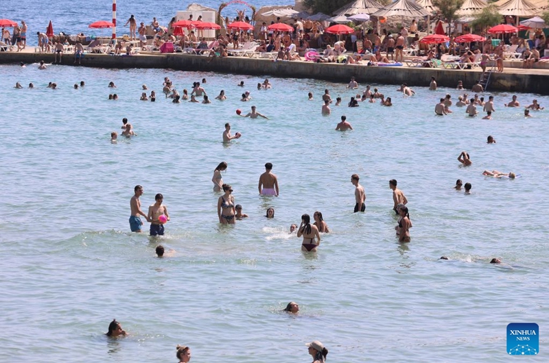 People enjoy leisure time at Bacvice Beach in Split, Croatia, on July 19, 2026. (Ivana Ivanovic/PIXSELL via Xinhua)