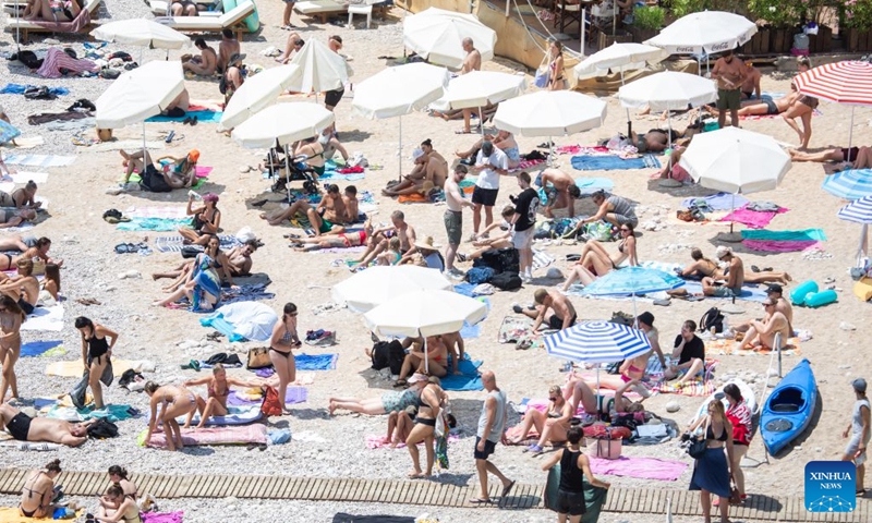 People enjoy leisure time at Bacvice Beach in Split, Croatia, on July 19, 2026. (Grgo Jelavic/PIXSELL via Xinhua)