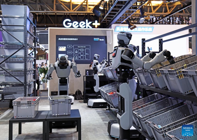 Humanoid robots demonstrate picking and sorting abilities during the 2026 World AI Conference and High-Level Meeting on Global AI Governance in Shanghai, east China, July 19, 2026. The event scheduled from Friday to Monday showcases exhibitions of a number of AI agent hardware and system products, highlighting the transition of next-generation AI from a tool to an intelligent partner, empowering various industries and everyday life. (Xinhua/Liu Ying)