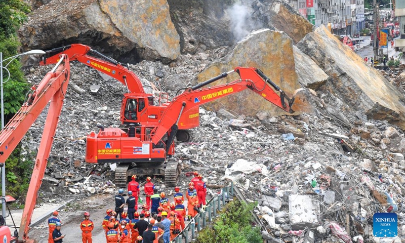Rescuers work at the site of a mountain collapse in Pengshui Miao and Tujia Autonomous County of Chongqing, southwest China, July 19, 2026. A rainfall-induced mountain collapse occurred at 9:08 a.m. on Friday in the Hanjia sub-district of Pengshui, burying more than 10 residential buildings, while leaving some local residents trapped and unaccounted for.
China activated a Level-II national emergency response for geological disasters. Multiple rescue forces including emergency response, fire control and public security rushed to the scene and launched full-scale search and rescue operations, while local residents also volunteered to take part in the rescue efforts. Photo: Xinhua
