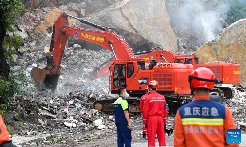 Rescuers work at the site of a mountain collapse in Pengshui Miao and Tujia Autonomous County of Chongqing, southwest China, July 19, 2026. A rainfall-induced mountain collapse occurred at 9:08 a.m. on Friday in the Hanjia sub-district of Pengshui, burying more than 10 residential buildings, while leaving some local residents trapped and unaccounted for.
China activated a Level-II national emergency response for geological disasters. Multiple rescue forces including emergency response, fire control and public security rushed to the scene and launched full-scale search and rescue operations, while local residents also volunteered to take part in the rescue efforts. Photo: Xinhua