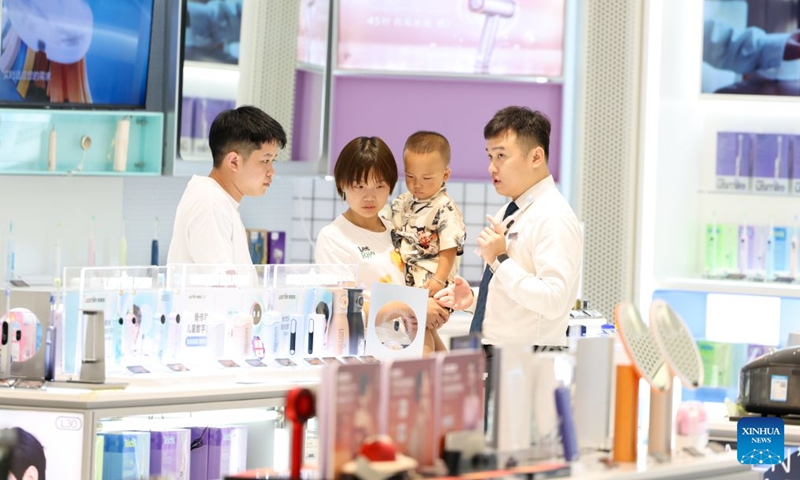 People shop at the Haikou International Duty Free Shopping Complex in Haikou, south China's Hainan Province, July 18, 2026. Hainan is experiencing a surge in duty-free shopping during this summer season. It is reported that in the first six months of this year, offshore duty-free sales totaled 19.92 billion yuan (about 2.93 billion U.S. dollars), involving 15.966 million duty-free items and 2.793 million shoppers, registering year-on-year growth of 18.8%, 7.3% and 12.6% respectively. (Xinhua/Yang Guanyu)