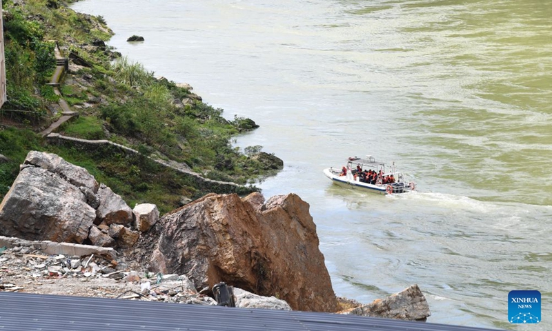 Rescuers work at the site of a mountain collapse in Pengshui Miao and Tujia Autonomous County of Chongqing, southwest China, July 19, 2026. A rainfall-induced mountain collapse occurred at 9:08 a.m. on Friday in the Hanjia sub-district of Pengshui, burying more than 10 residential buildings, while leaving some local residents trapped and unaccounted for.
China activated a Level-II national emergency response for geological disasters. Multiple rescue forces including emergency response, fire control and public security rushed to the scene and launched full-scale search and rescue operations, while local residents also volunteered to take part in the rescue efforts. Photo: Xinhua