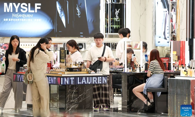 People shop at the Haikou International Duty Free Shopping Complex in Haikou, south China's Hainan Province, July 18, 2026. Hainan is experiencing a surge in duty-free shopping during this summer season. It is reported that in the first six months of this year, offshore duty-free sales totaled 19.92 billion yuan (about 2.93 billion U.S. dollars), involving 15.966 million duty-free items and 2.793 million shoppers, registering year-on-year growth of 18.8%, 7.3% and 12.6% respectively. (Xinhua/Yang Guanyu)