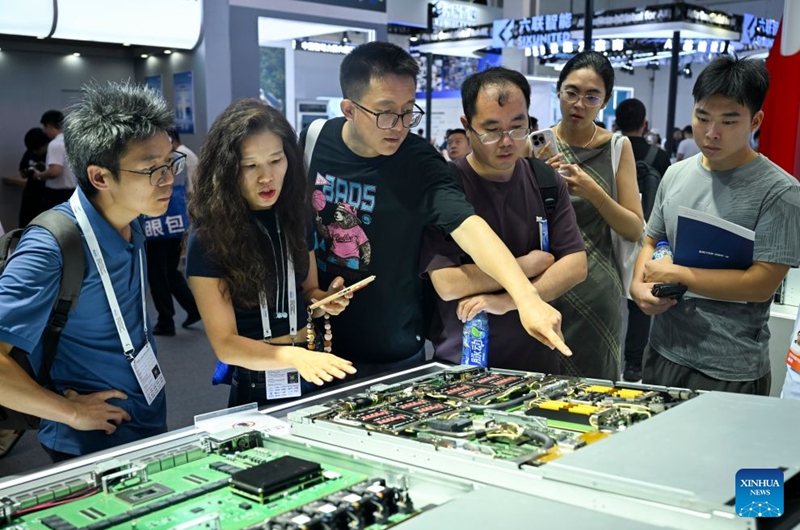 People visit the booth of Enflame Technology during the 2026 World AI Conference and High-Level Meeting on Global AI Governance in Shanghai, east China, July 19, 2026. The 2026 World AI Conference (WAIC) and High-Level Meeting on Global AI Governance opened here on Friday. A group of domestic supernode products draw public attentions during the event. (Xinhua/Chen Haoming)