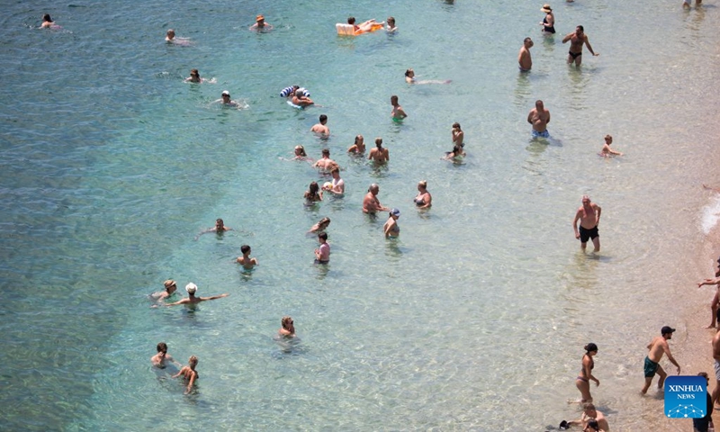 People enjoy leisure time at Bacvice Beach in Split, Croatia, on July 19, 2026. (Grgo Jelavic/PIXSELL via Xinhua)