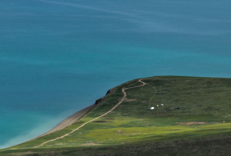 An aerial drone photo taken on July 12, 2026 shows a view of the Ngoring Lake in Golog Tibetan Autonomous Prefecture of northwest China's Qinghai Province. (Xinhua/Zhang Long)