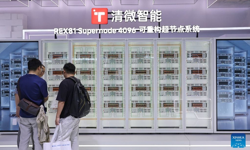 People view the REX81 Supernode 4096 system displayed during the 2026 World AI Conference and High-Level Meeting on Global AI Governance in Shanghai, east China, July 17, 2026. The 2026 World AI Conference (WAIC) and High-Level Meeting on Global AI Governance opened here on Friday. A group of domestic supernode products draw public attentions during the event. (Xinhua/Fang Zhe)