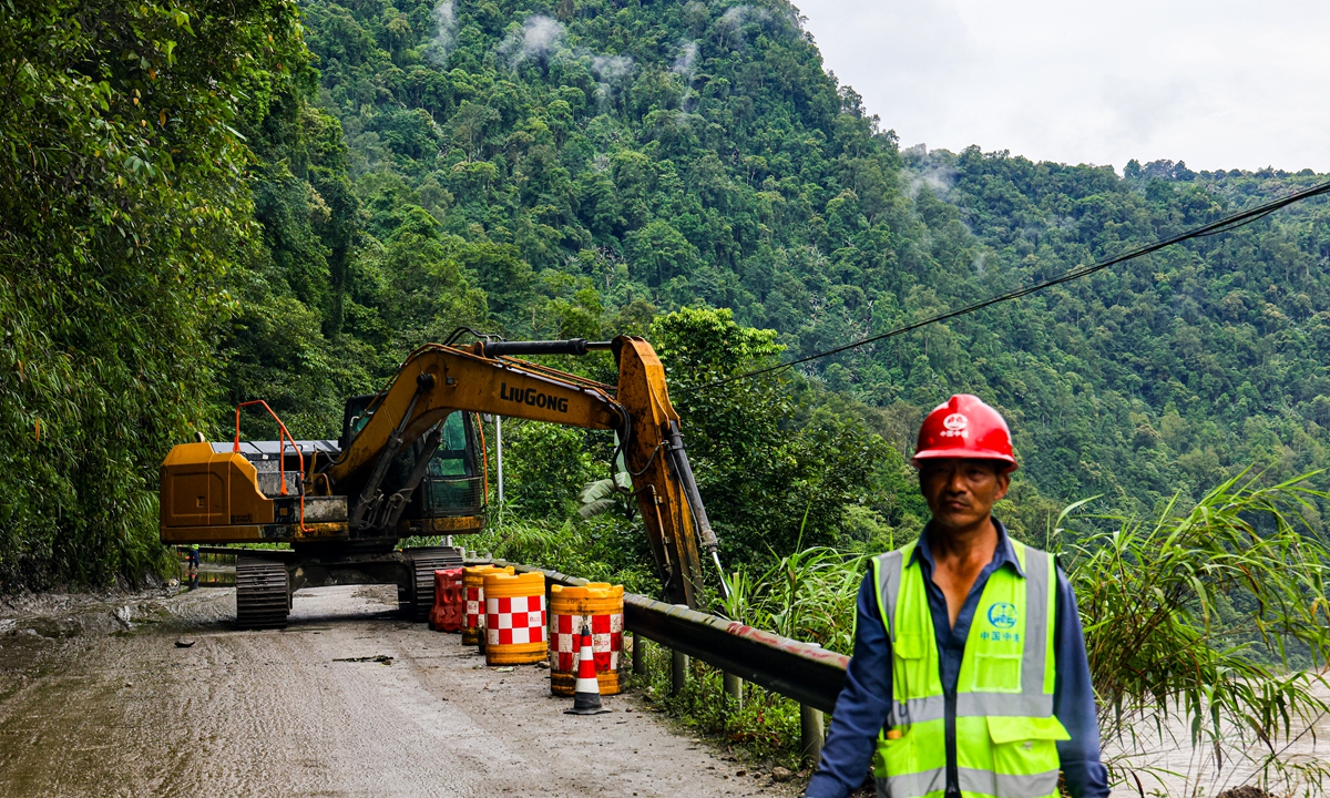 A road maintenance worker stands on the highway in Medog on June 30, 2026. Photo: Fan Wei/GT