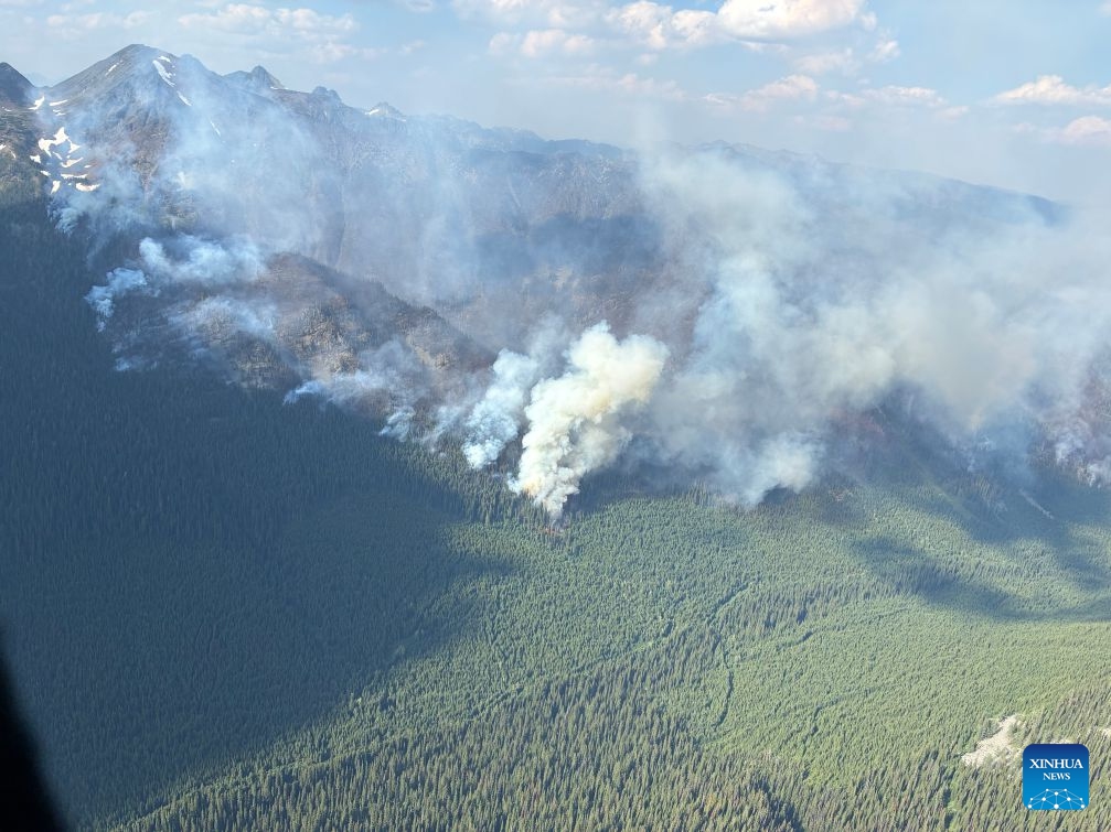 An aerial photo provided by the BC Wildfire Service on July 18 shows a wildfire near Kimberley in southeastern British Columbia, Canada. Latest statistics show a total of 3,839 wildland fires have been recorded across Canada so far this year, consuming more than 2.9 million hectares of forest. (BC Wildfire Service/Handout via Xinhua)