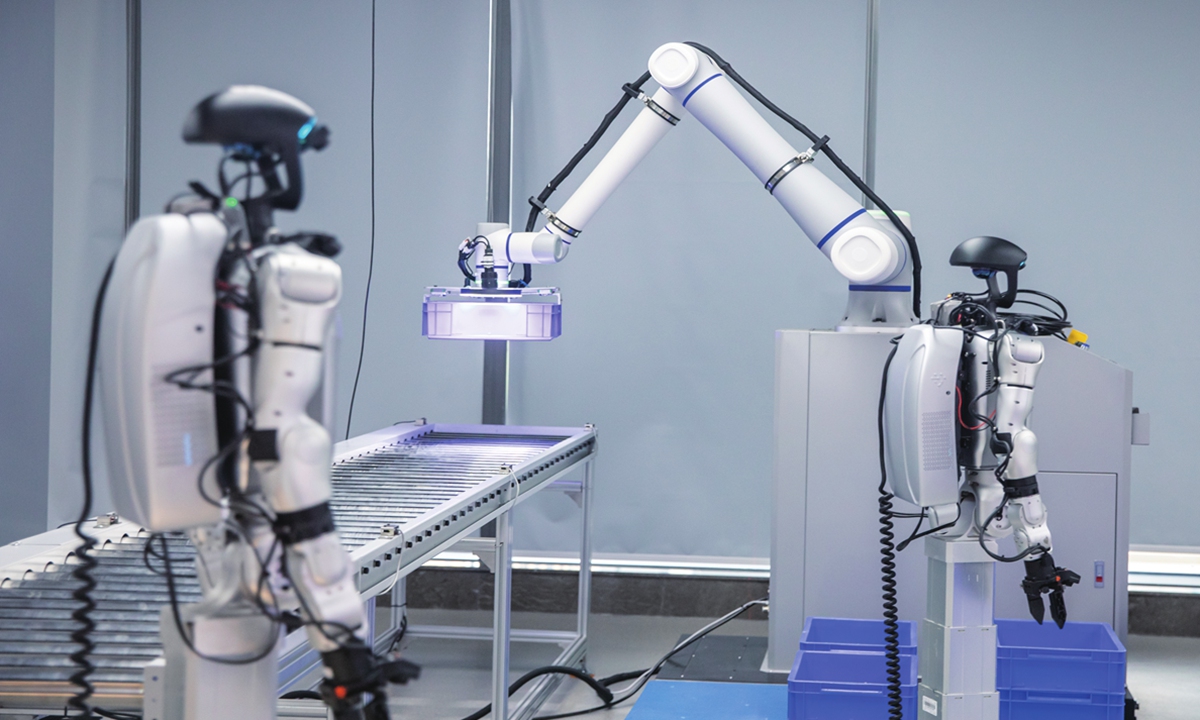 A robot trains for logistics and warehouse operations at an embodied AI demonstration center in Hangzhou, East China's Zhejiang Province, on June 11, 2026. Photo: VCG