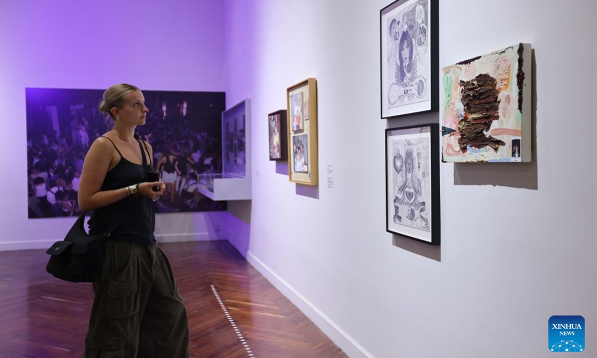 A visitor views exhibits at the Museum of Palacio de Bellas Artes, in Mexico City, Mexico, on July 19, 2026. The museum offers free admission on Sundays, attracting large numbers of residents and tourists to explore its exhibitions. (Xinhua/Liu Wenhui)