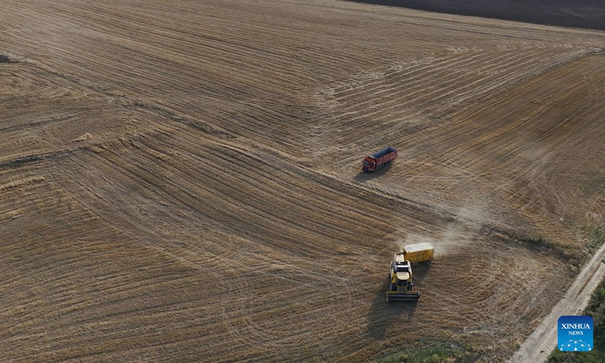 An aerial drone photo shows a harvester at a wheat field in Ankara, Türkiye, on July 19, 2026. (Mustafa Kaya/Handout via Xinhua)