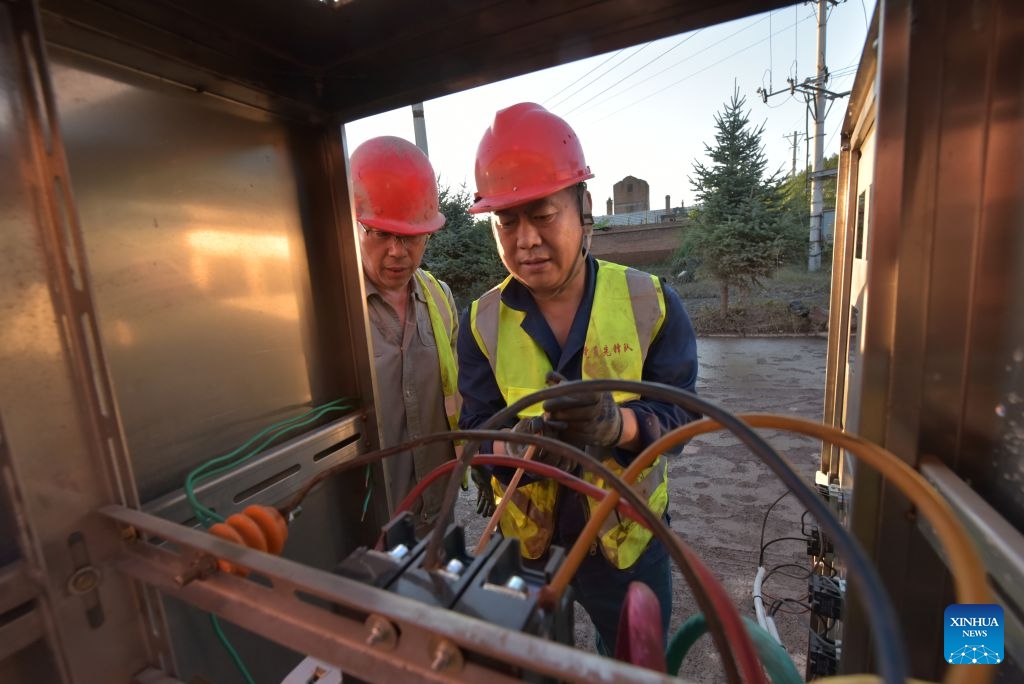 Staff members repair water supply facilities in Wenchun Township of Xi'an District, Mudanjiang, northeast China's Heilongjiang Province, July 20, 2026. Water supply and power departments in Mudanjiang have stepped up efforts to restore water and electricity services in the affected areas as flooding gradually recedes in the city. (Photo by Zhang Chunxiang/Xinhua)