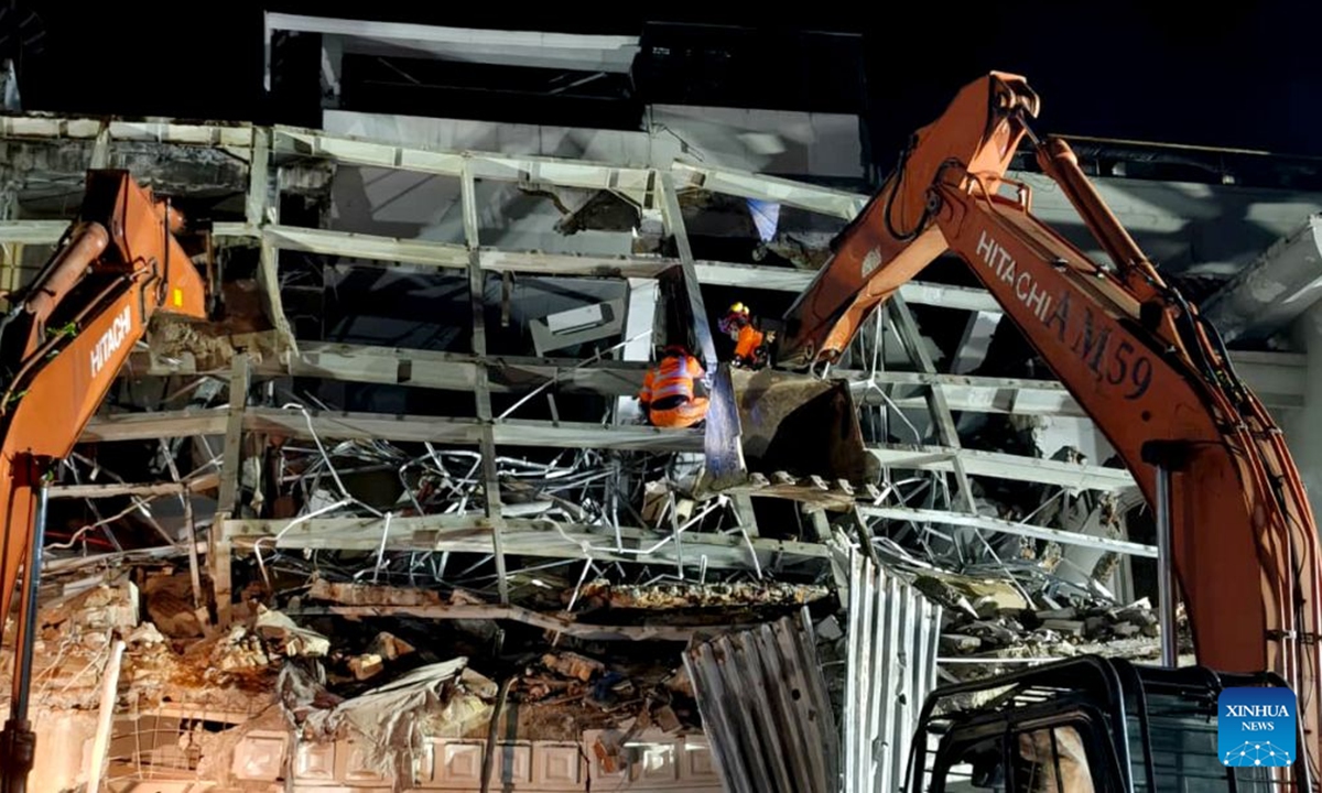 This photo provided by Indonesia's National Search and Rescue Agency (Basarnas) Medan shows rescuers working at the scene after a powerful explosion in a residential complex in Medan, North Sumatra, Indonesia, July 21, 2026. A powerful explosion tore through a three-story house in a residential complex in the western Indonesian city of Medan on Monday evening, killing three people and causing extensive damage to surrounding properties, authorities said Tuesday. (Basarnas Medan/Handout via Xinhua)