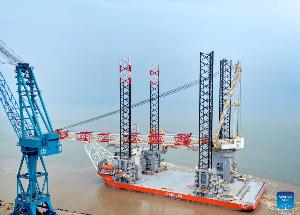 A drone photo taken on July 21, 2026 shows the NG20000 wind turbine installation vessel Fengsheng being officially delivered and setting sail in Qidong, east China's Jiangsu Province.
A vessel customized by COSCO Shipping (Qidong) Offshore Co., Ltd. for a Danish shipping company was officially delivered and set sail on Tuesday.
The vessel features a super-large deck of over 5,600 square meters, a payload of 17,600 tonnes, and a main crane lifting capacity of more than 3,300 tonnes. It is capable of installing wind turbines of 20 megawatts and above. (Photo by Xu Congjun/Xinhua)