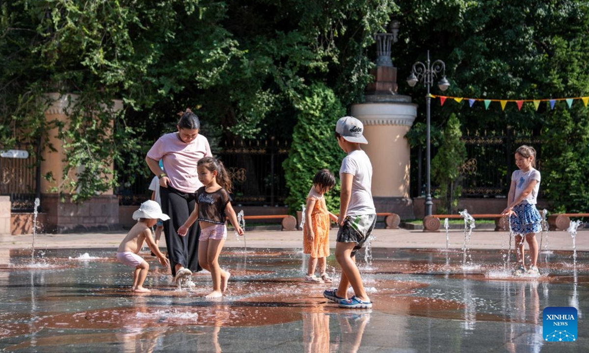 Children cool off at Central Park in Almaty, Kazakhstan, on July 20, 2026. (Str/Xinhua)