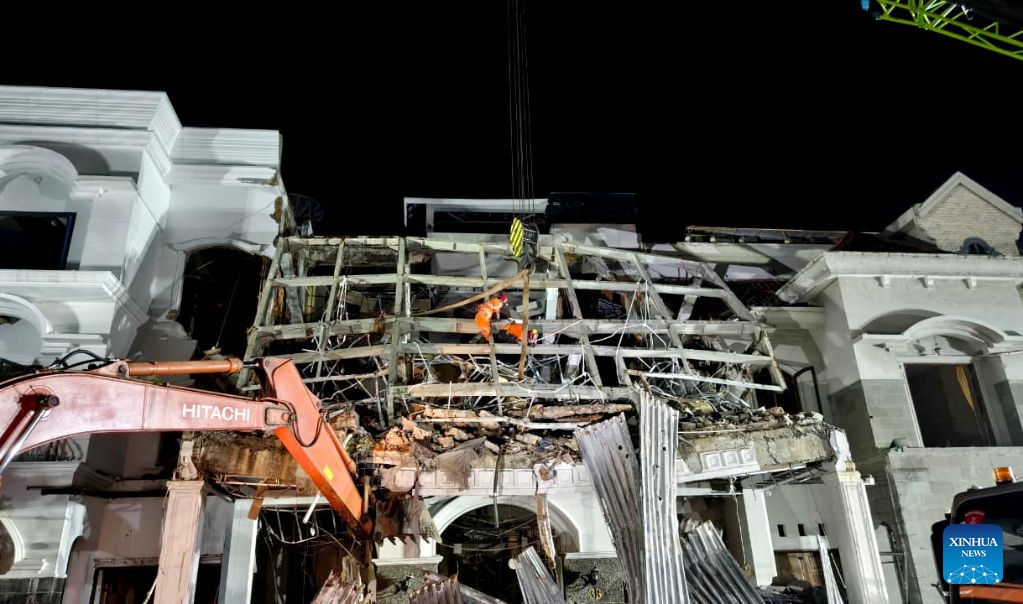 This photo provided by Indonesia's National Search and Rescue Agency (Basarnas) Medan shows rescuers working at the scene after a powerful explosion in a residential complex in Medan, North Sumatra, Indonesia, July 21, 2026. A powerful explosion tore through a three-story house in a residential complex in the western Indonesian city of Medan on Monday evening, killing three people and causing extensive damage to surrounding properties, authorities said Tuesday. (Basarnas Medan/Handout via Xinhua)