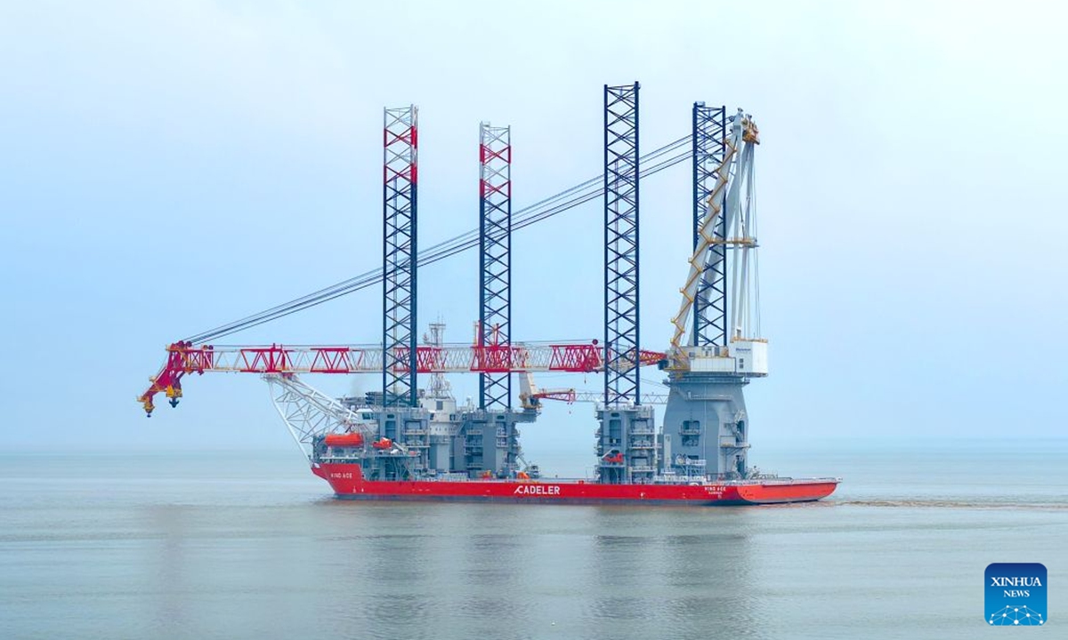 A drone photo taken on July 21, 2026 shows the NG20000 wind turbine installation vessel Fengsheng being officially delivered and setting sail in Qidong, east China's Jiangsu Province.
A vessel customized by COSCO Shipping (Qidong) Offshore Co., Ltd. for a Danish shipping company was officially delivered and set sail on Tuesday.
The vessel features a super-large deck of over 5,600 square meters, a payload of 17,600 tonnes, and a main crane lifting capacity of more than 3,300 tonnes. It is capable of installing wind turbines of 20 megawatts and above. (Photo by Xu Congjun/Xinhua)