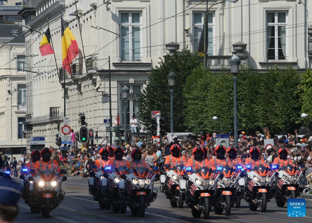 Motorists march during a military and civil parade of Belgian National Day celebrations in Brussels, Belgium, on July 21, 2026. (Xinhua/Weng Xinyang)