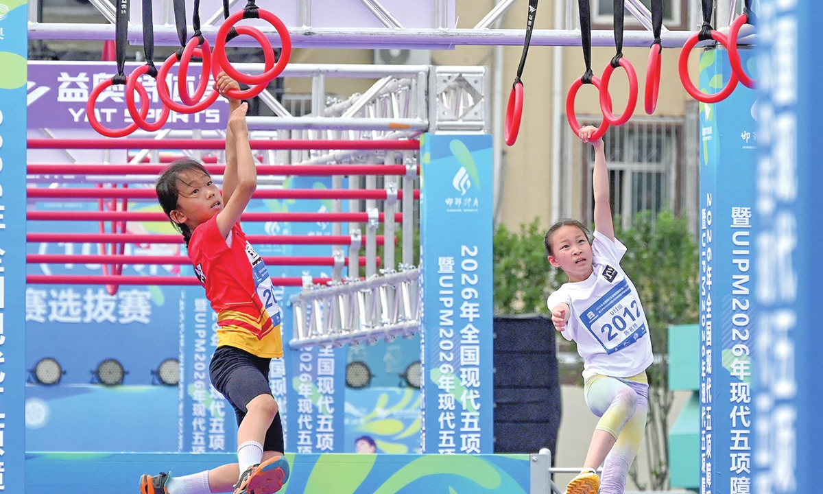 Young athletes compete in a modern pentathlon obstacle race in Handan, North China's Hebei Province, on July 11, 2026. Photo: VCG