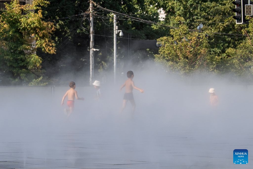 Children cool off at Central Park in Almaty, Kazakhstan, on July 20, 2026. (Str/Xinhua)