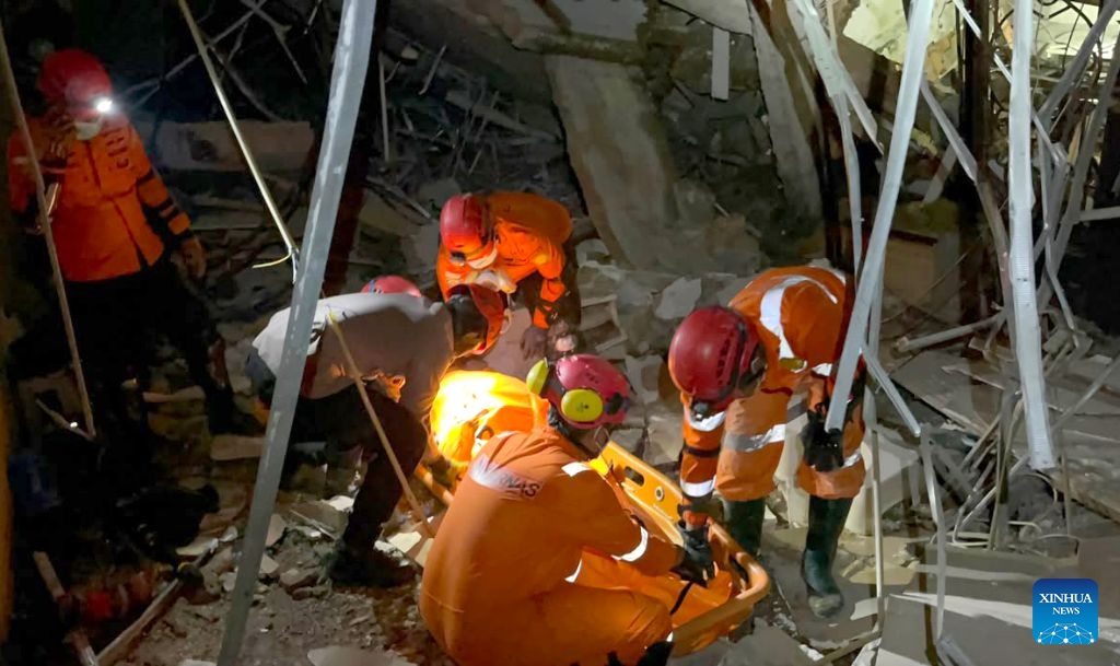 This photo provided by Indonesia's National Search and Rescue Agency (Basarnas) Medan shows rescuers working at the scene after a powerful explosion in a residential complex in Medan, North Sumatra, Indonesia, July 21, 2026. A powerful explosion tore through a three-story house in a residential complex in the western Indonesian city of Medan on Monday evening, killing three people and causing extensive damage to surrounding properties, authorities said Tuesday. (Basarnas Medan/Handout via Xinhua)
